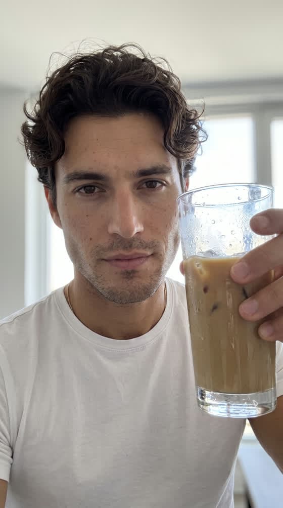 The avatar holding an iced coffee